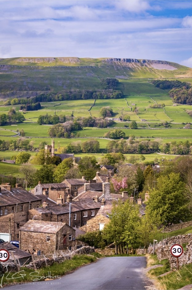 Swaledale village overlooked by hills